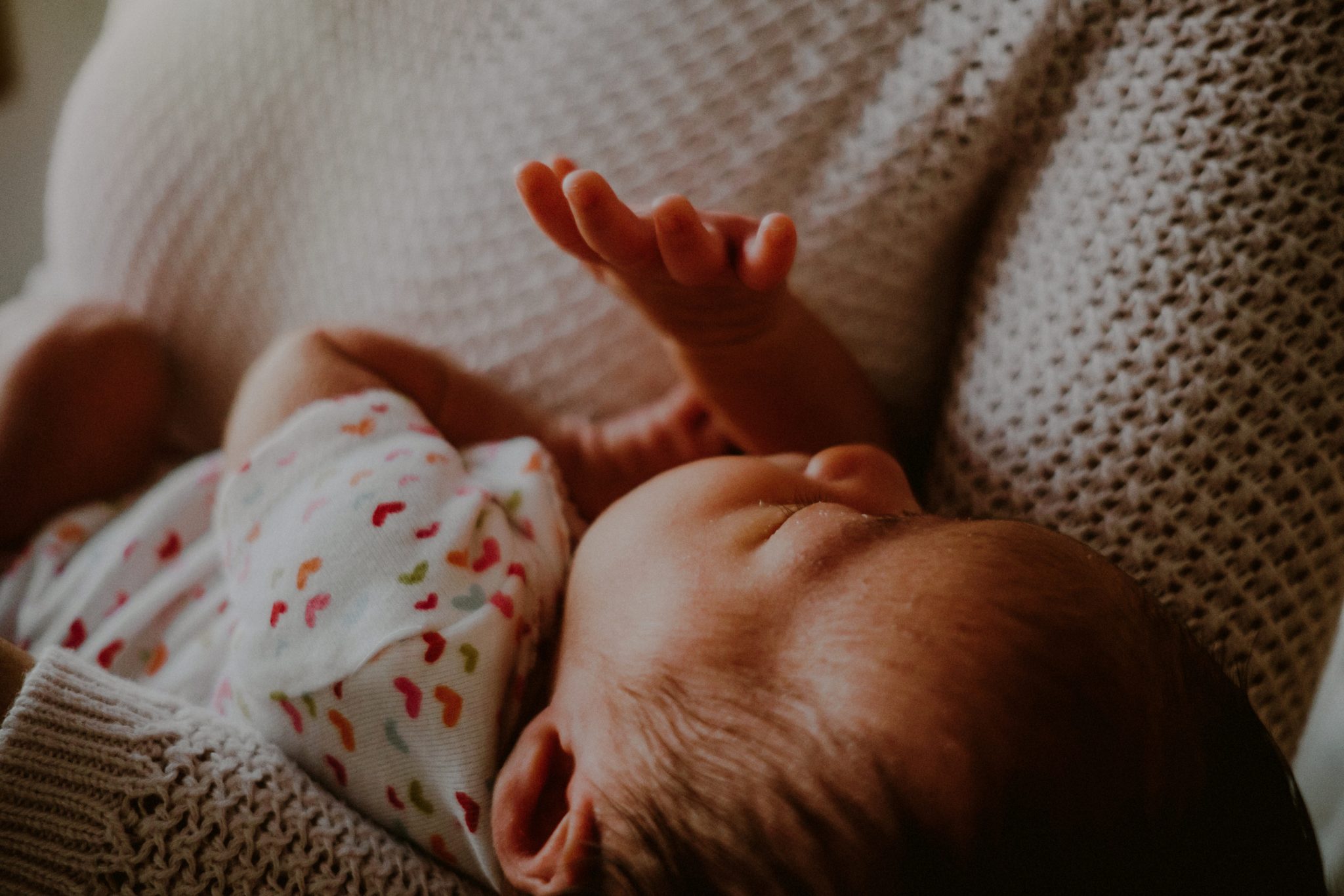 newborn baby photo details, closeup of tiny fingers of baby