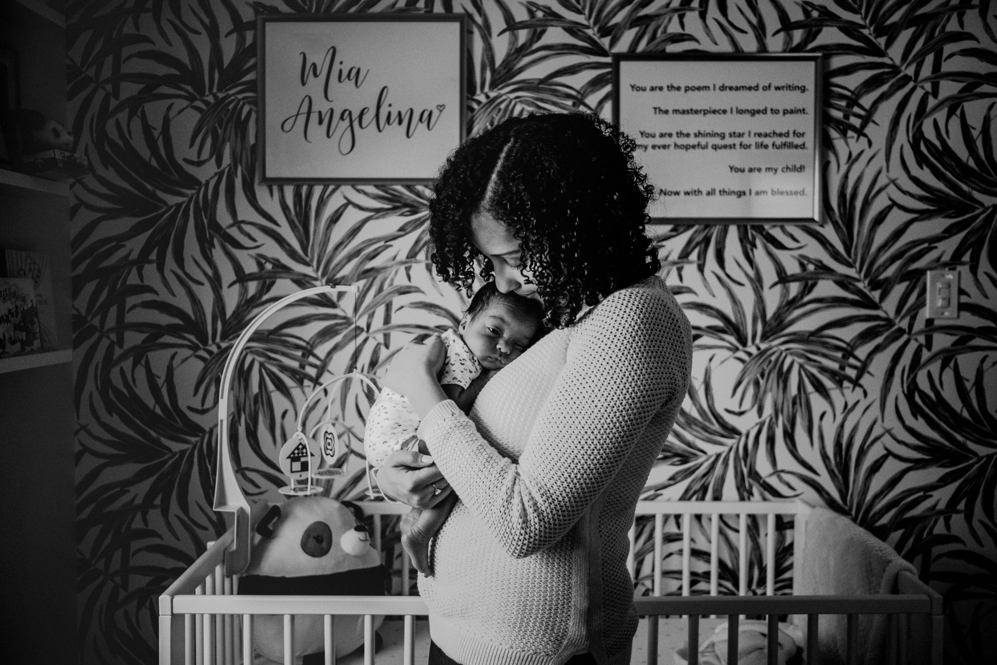 mother daughter photo in newborn baby's bedroom in black and white