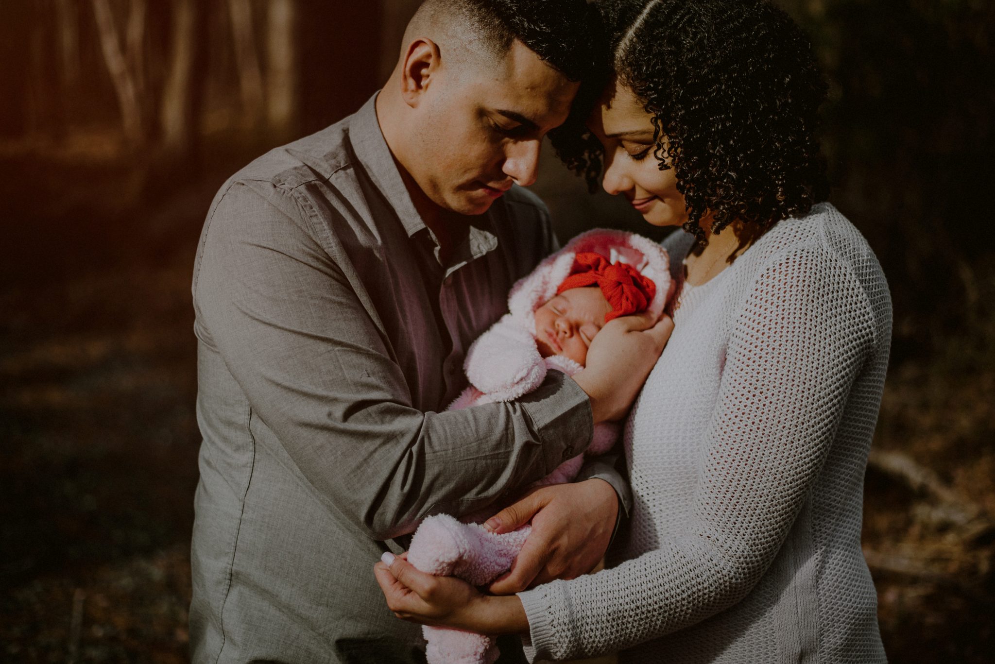 family portrait in the woods with newborn baby