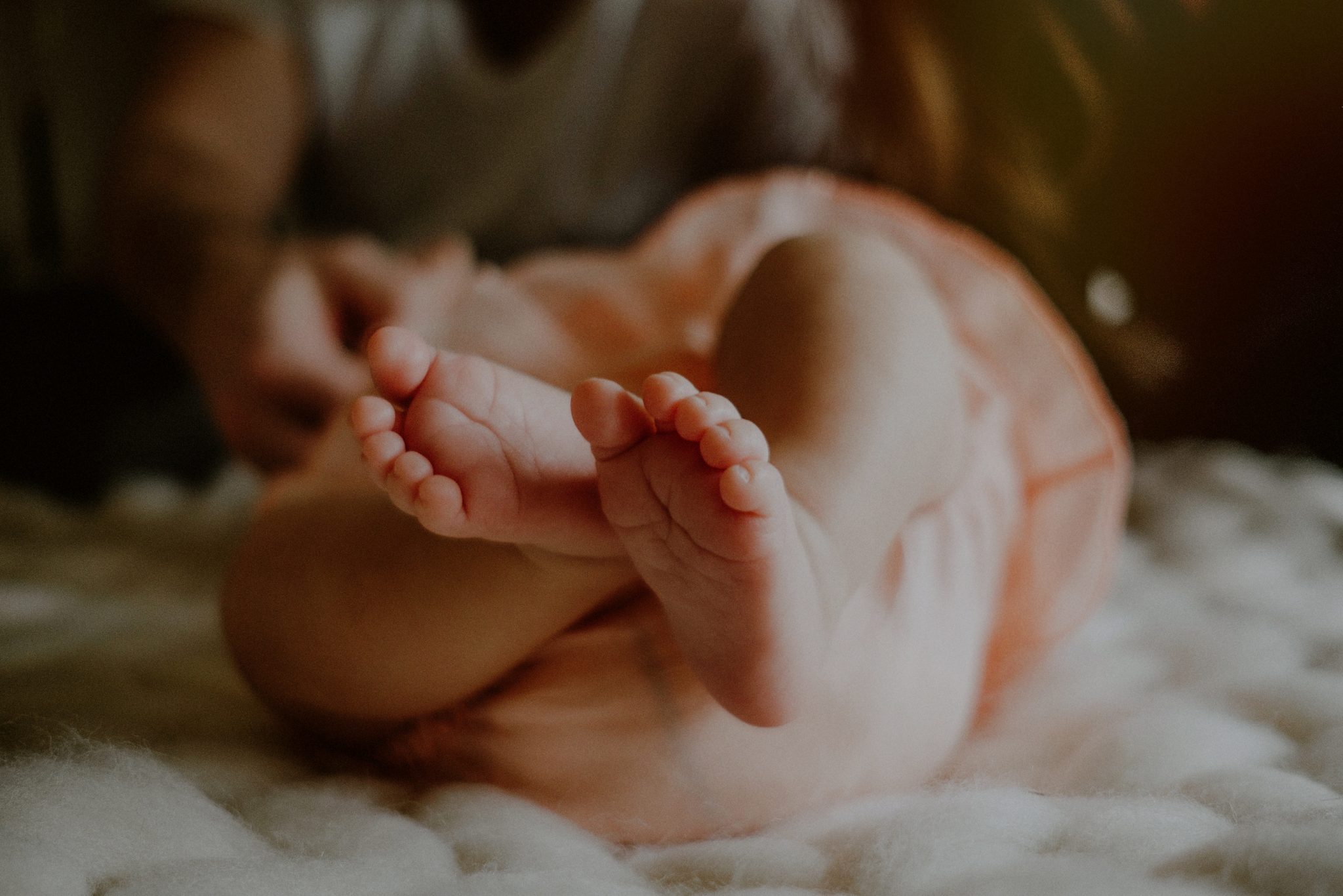 closeup of newborn baby toes and feet