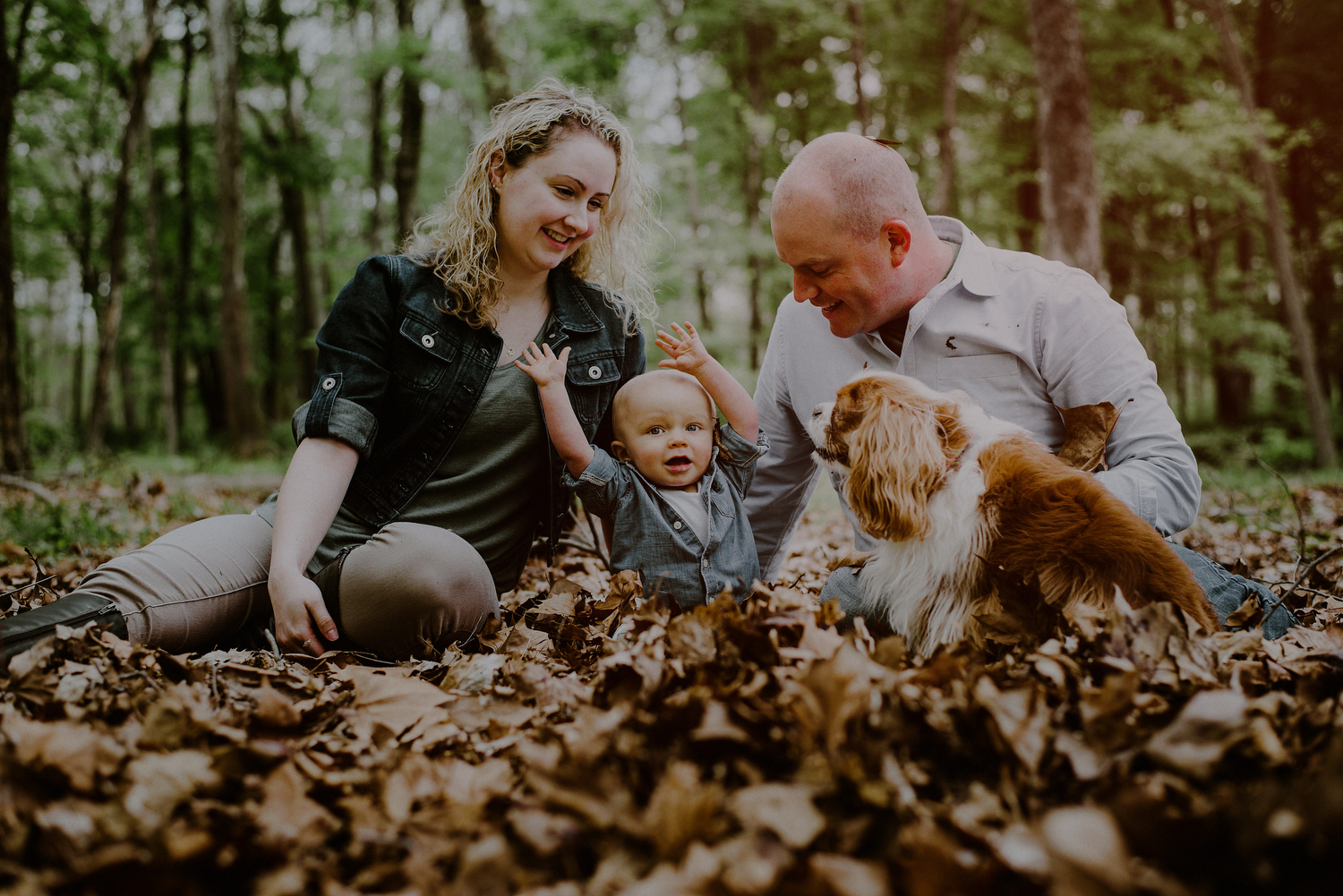 family photo on dried leaves having fun