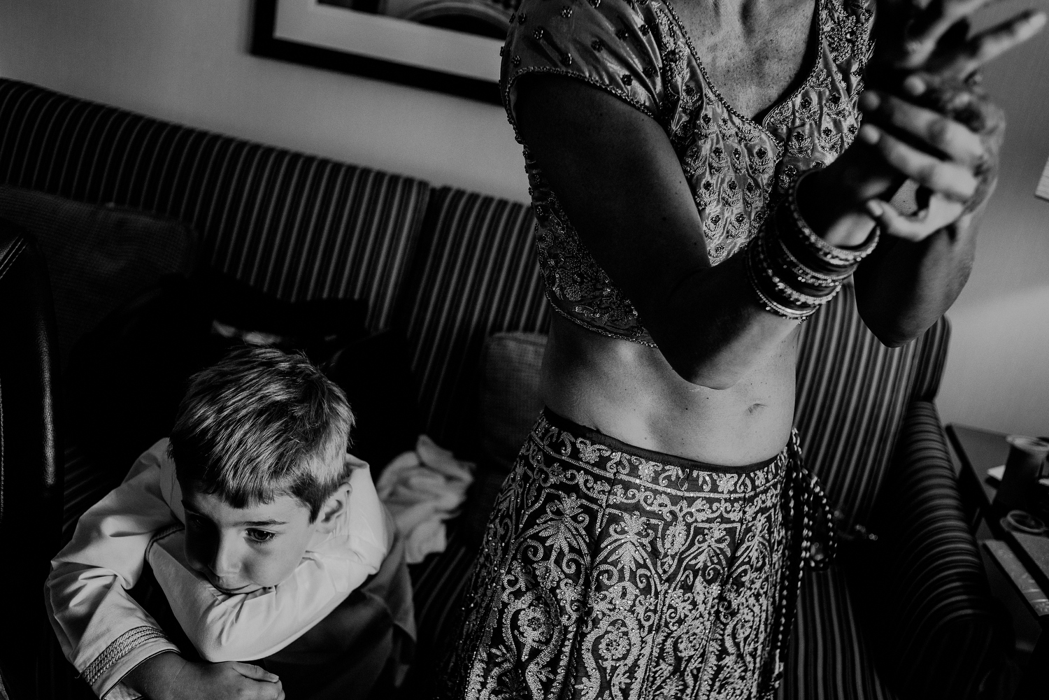 indian bride getting ready next to son in hotel in Randolph NJ