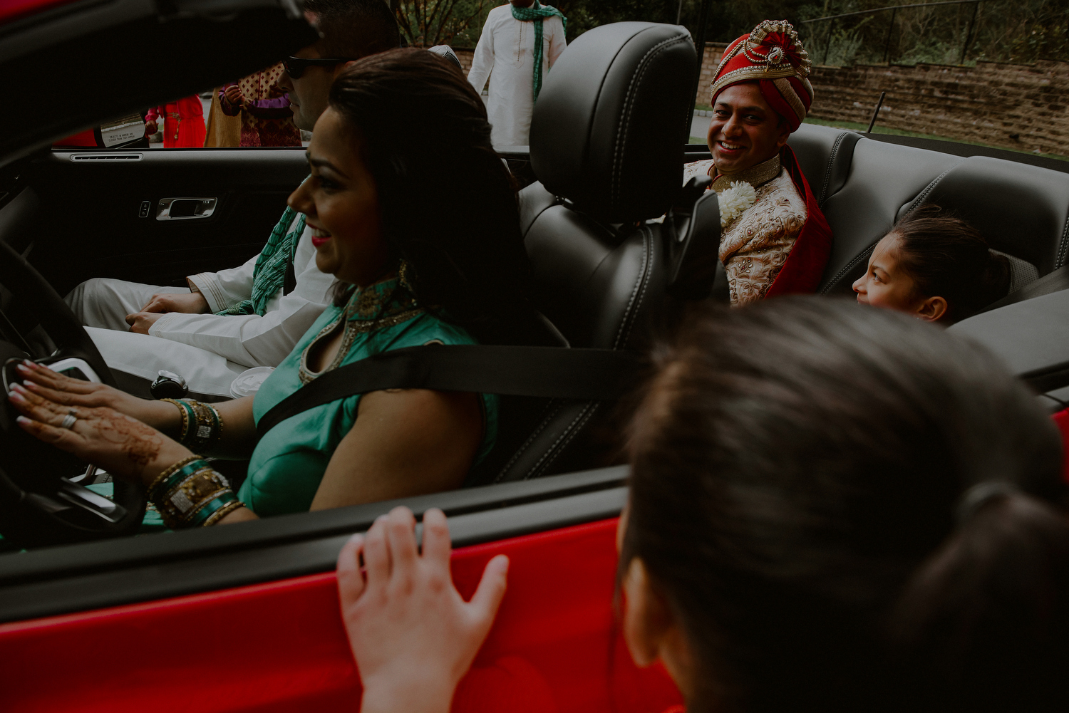 groom arrival to baraat in red corvette