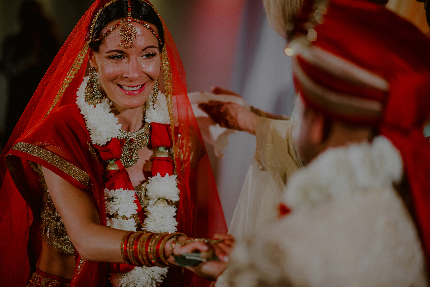 bride looks at groom during moment in indian wedding ceremony