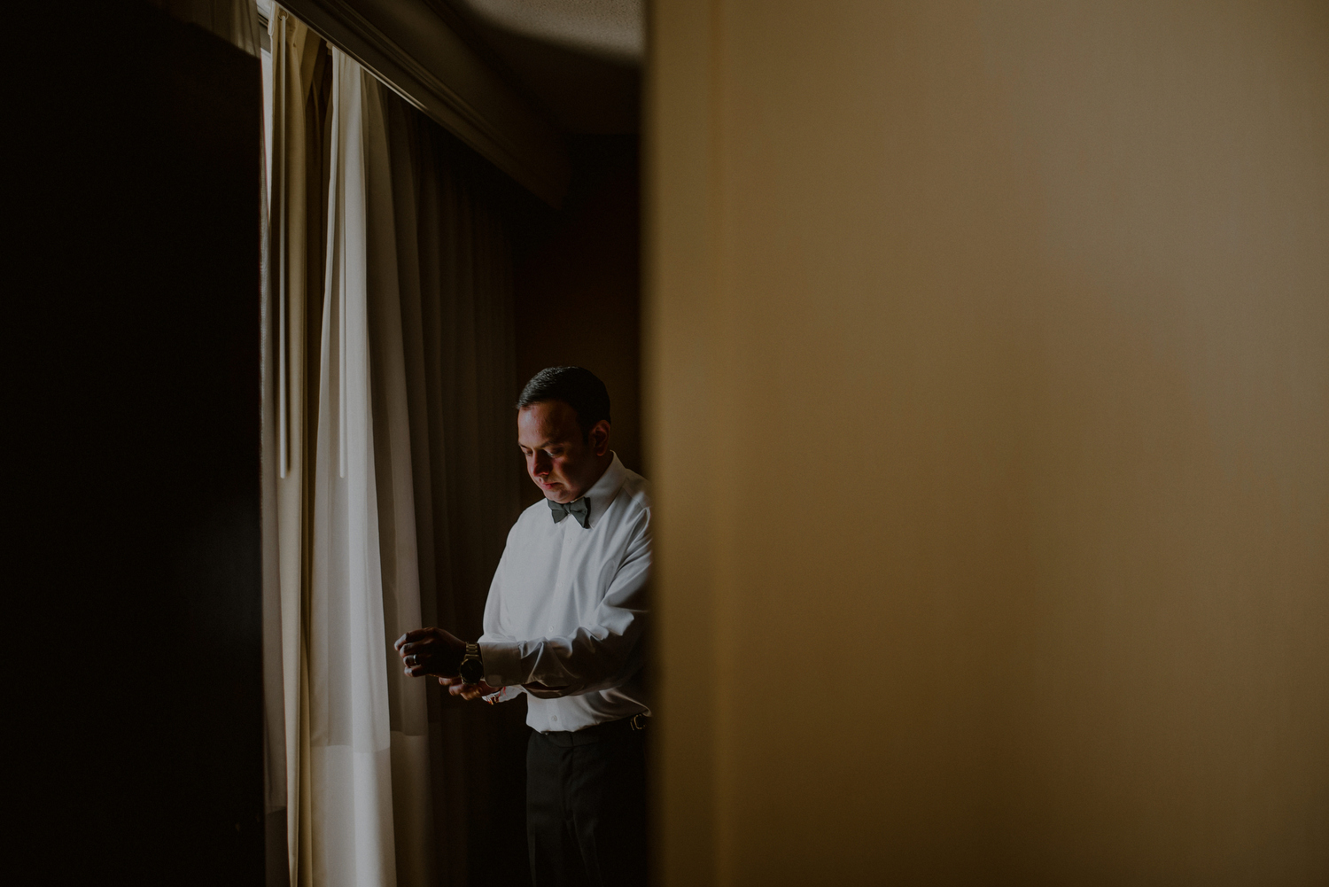 groom gets changed for wedding