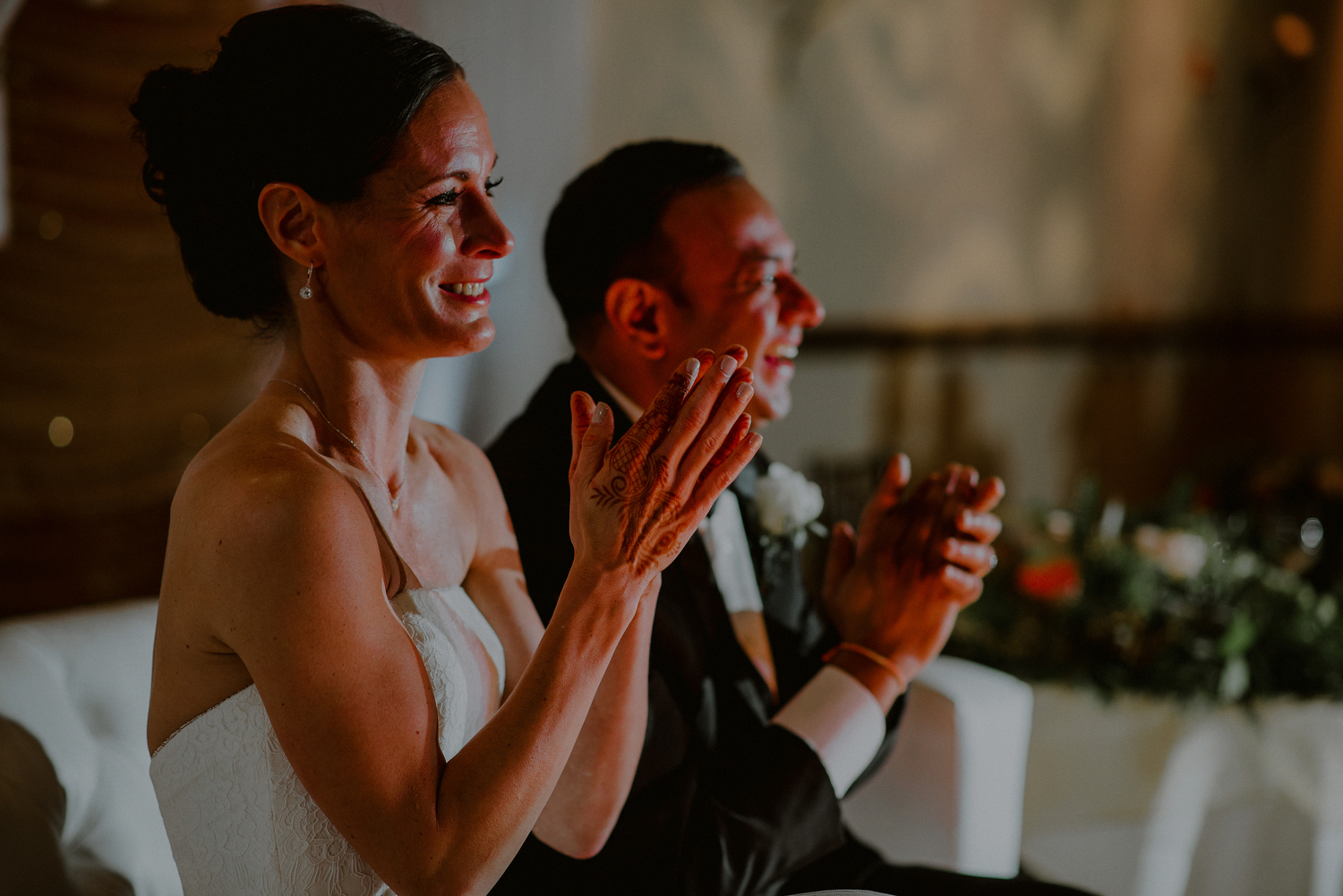 creative photograph of couple laughing during speeches