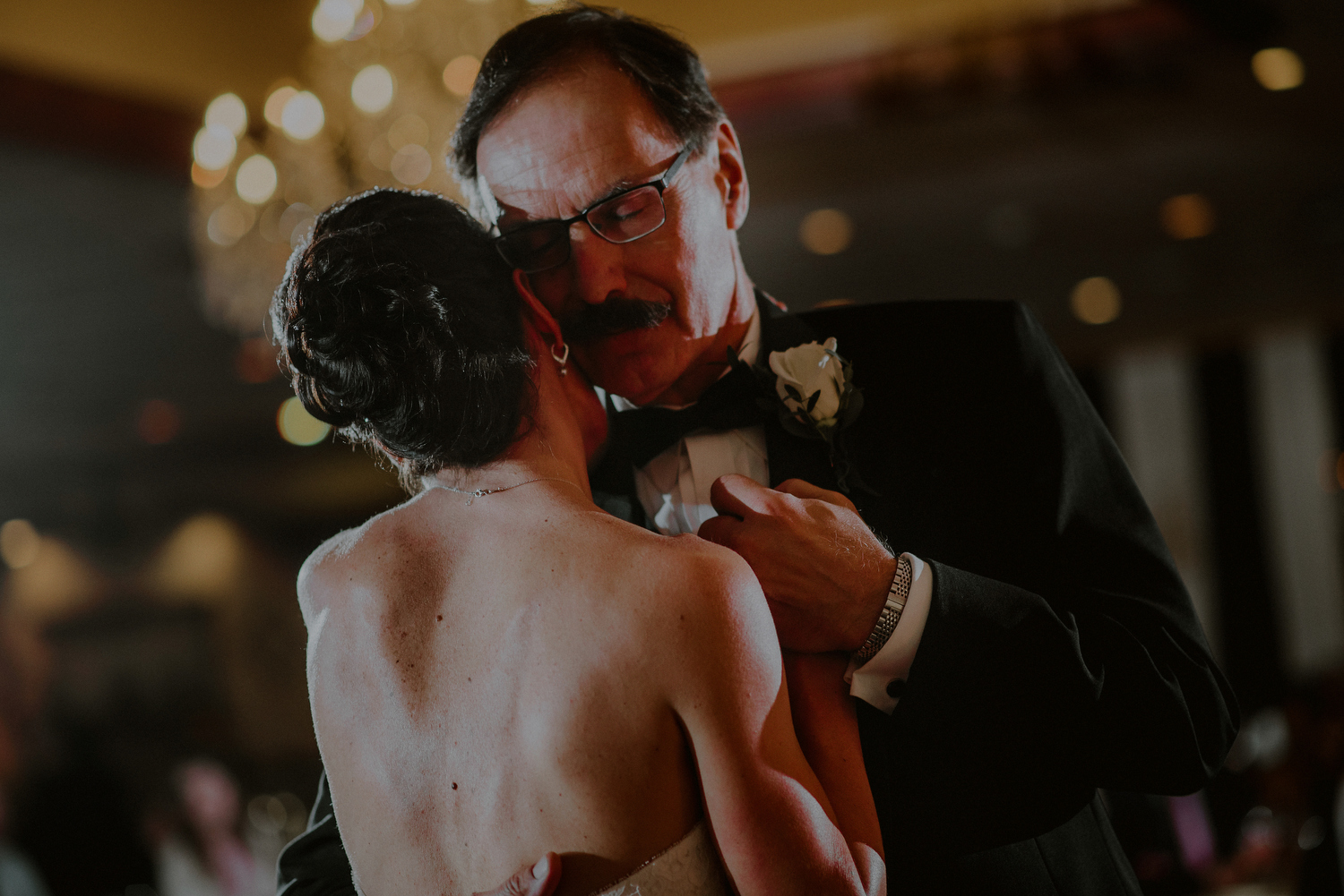 emotional father daughter dance during wedding reception