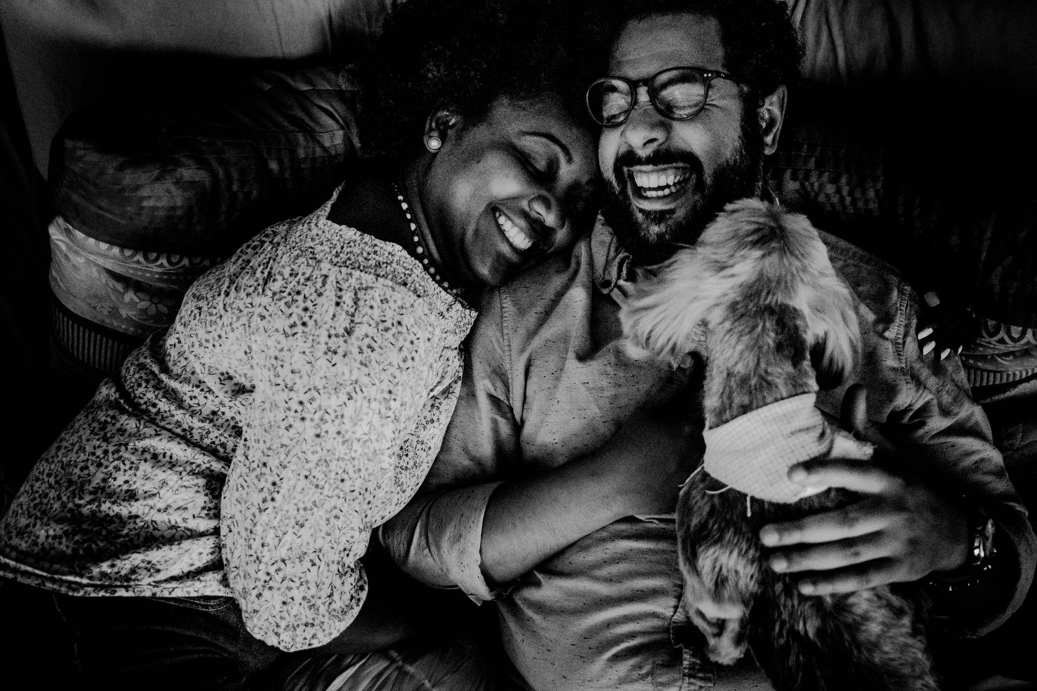 natural queens ny engagement photos of couple in home with dog