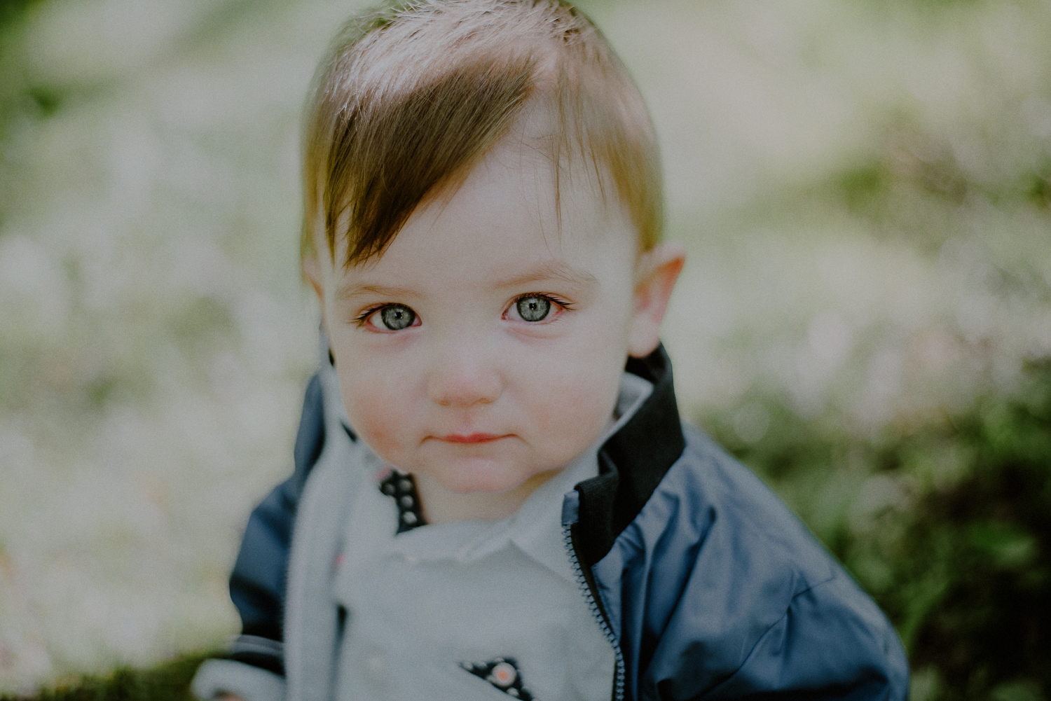 blue eyed infant looking into camera