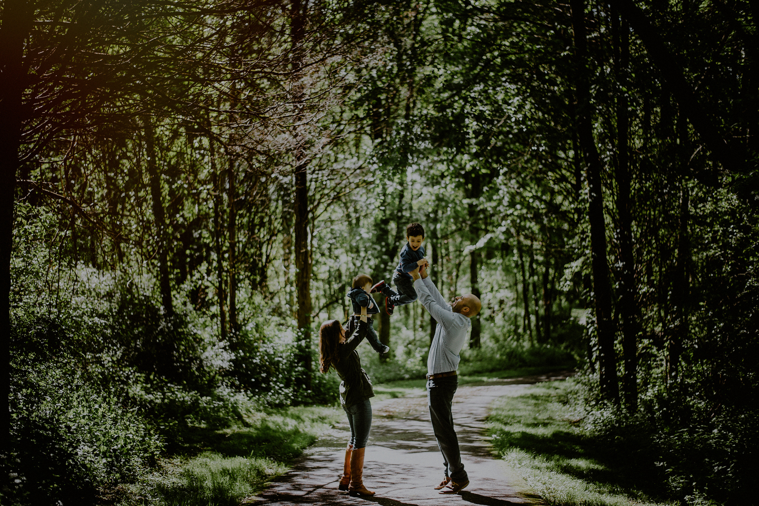 spring family photos having fun in the woods