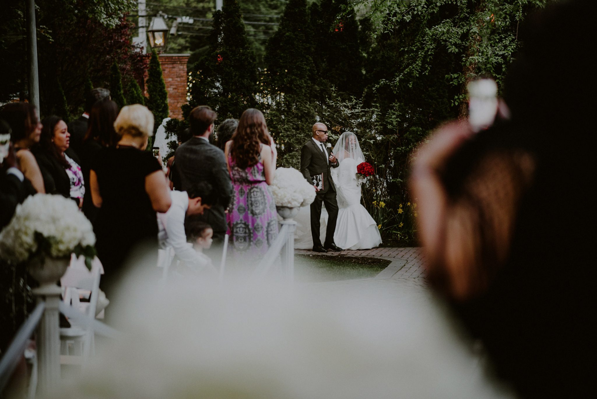 bride walks down the aisle with father during her fox hollow wedding