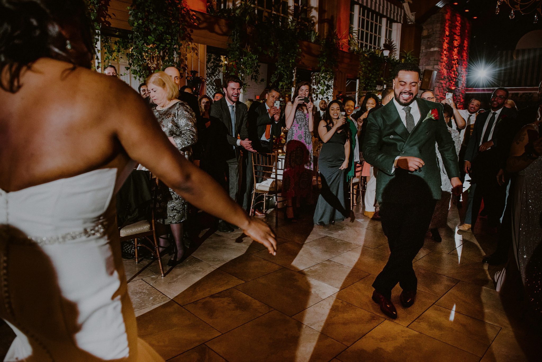 bride and groom dance into wedding entrance