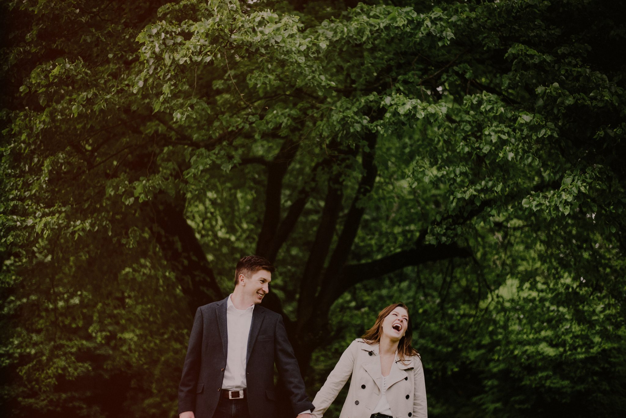 couple bursting in laughter during engagement session