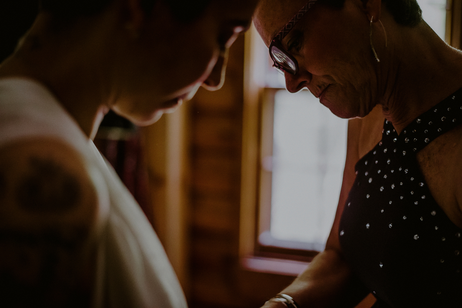 intimate wedding photos while bride gets dressed at mother's house in nj