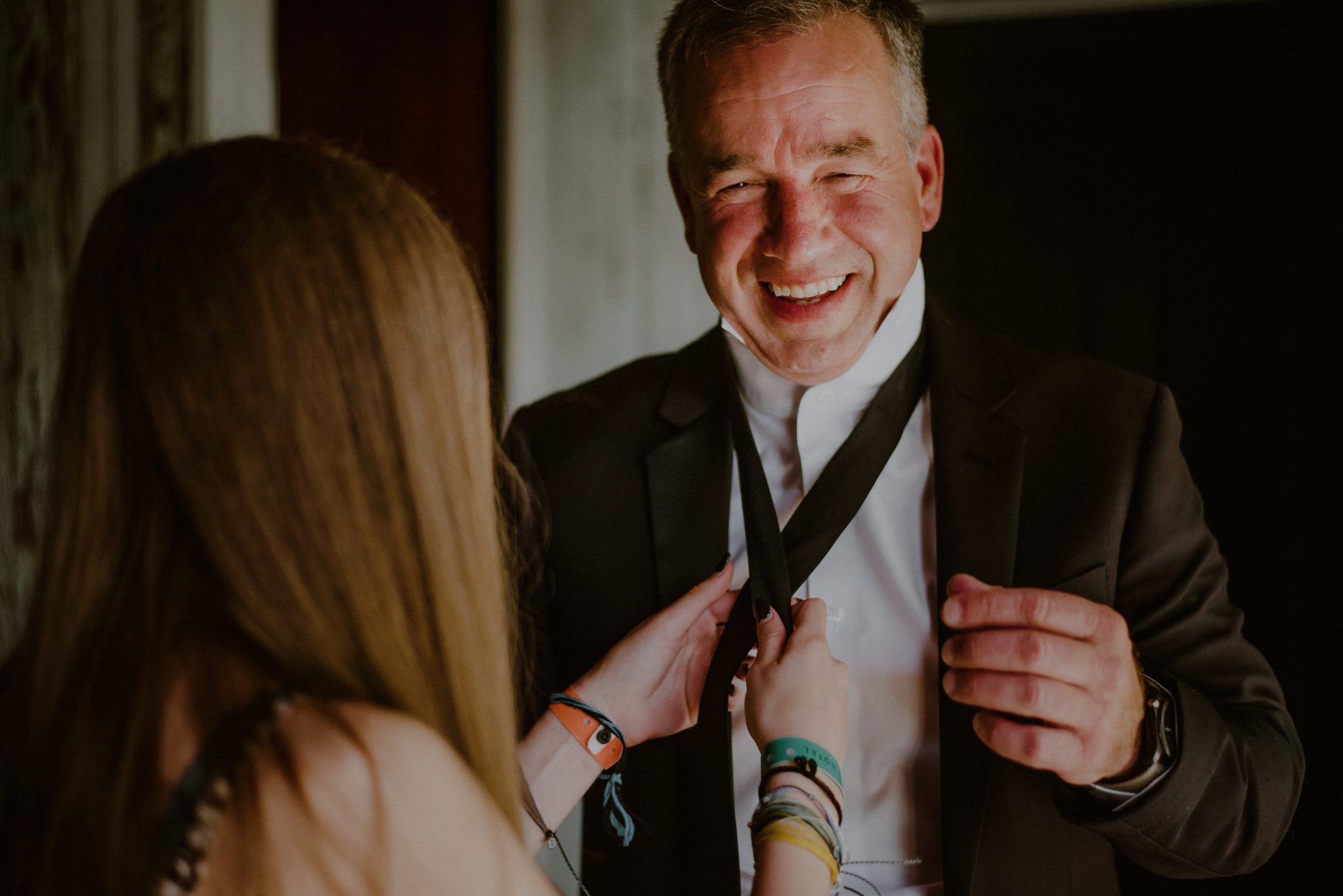 candid moment with groom and daughter 