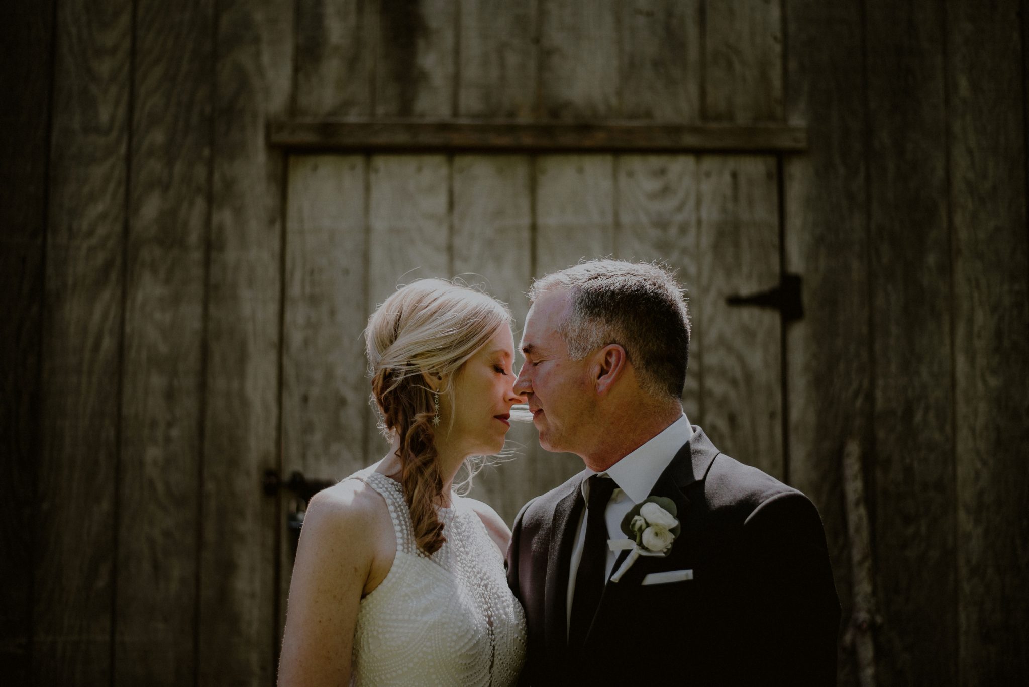 emotional wedding portrait of bride and groom