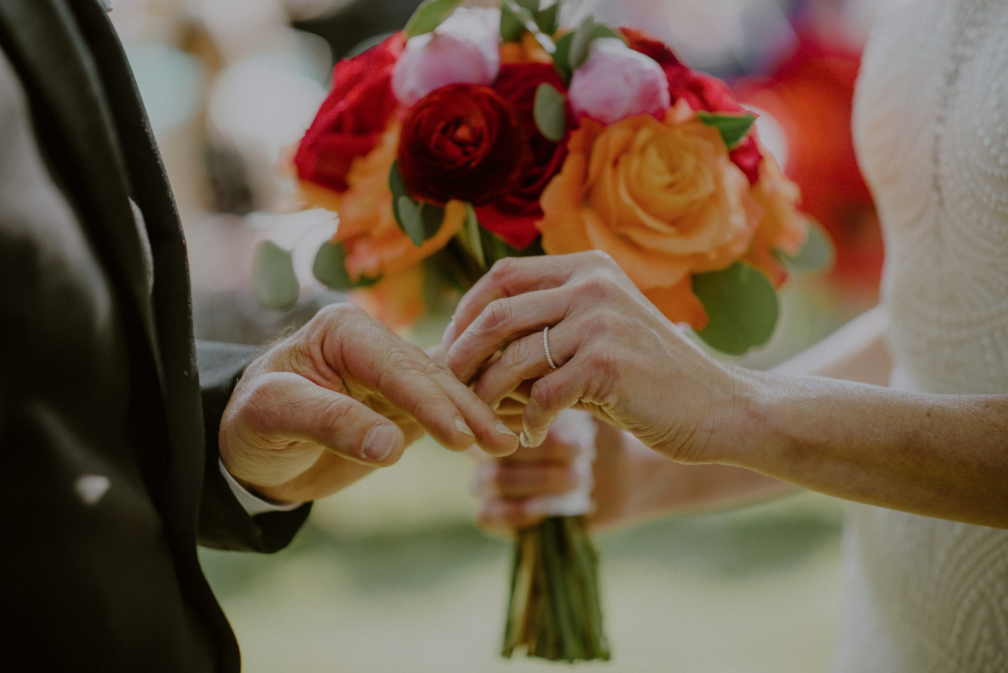 exchanging of rings during wedding ceremony at beach plum farm