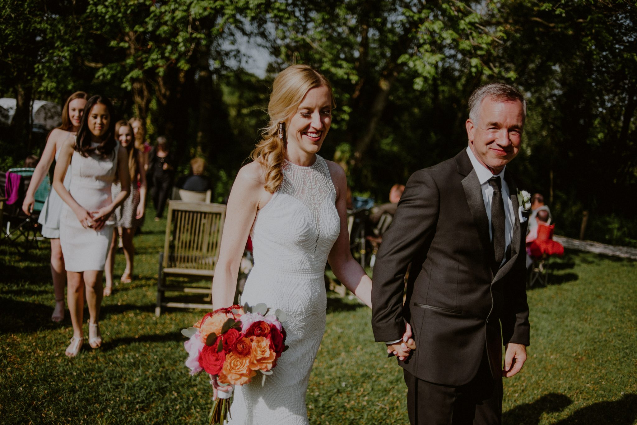 happy couple exit wedding ceremony at beach plum farm