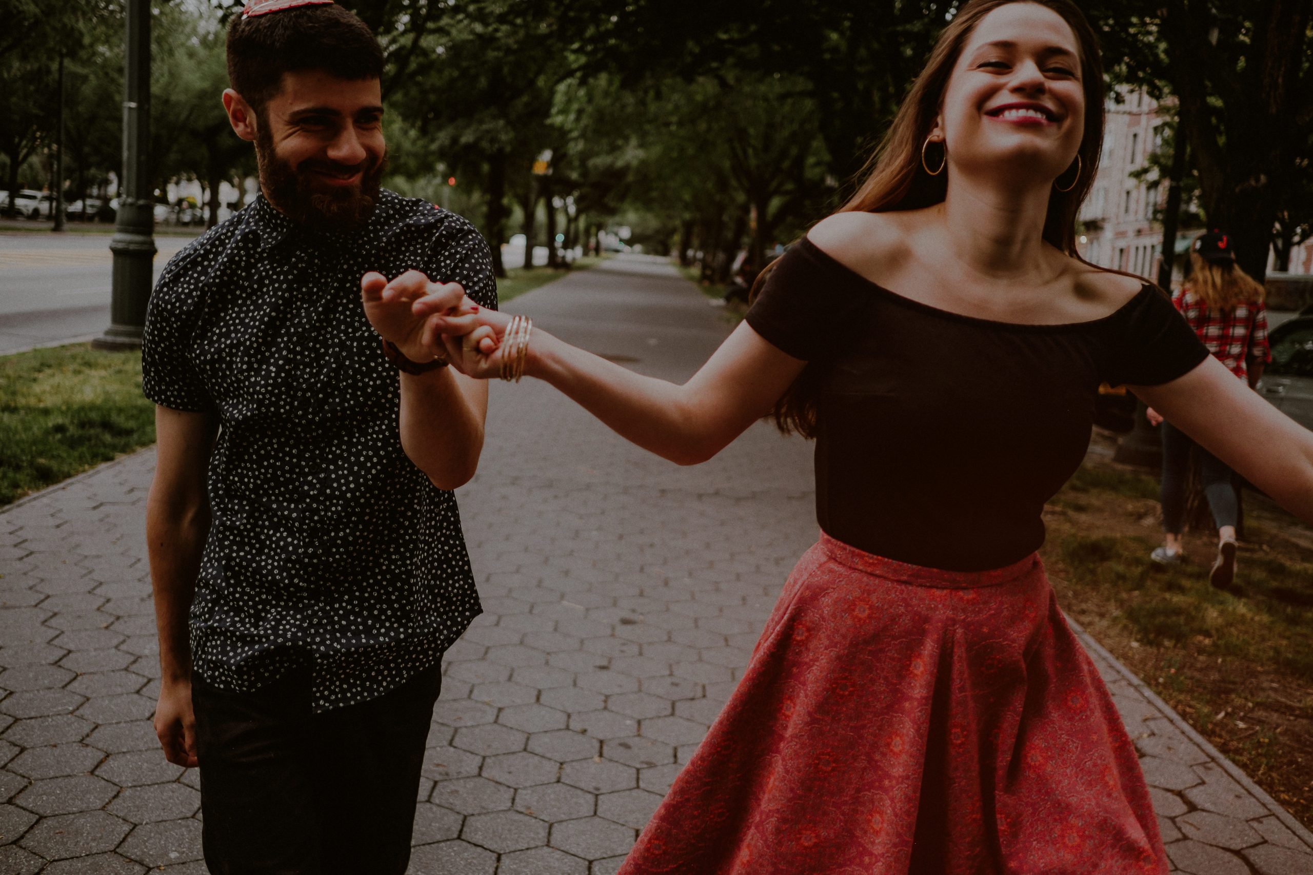 engaged couple dances on streets of brooklyn ny