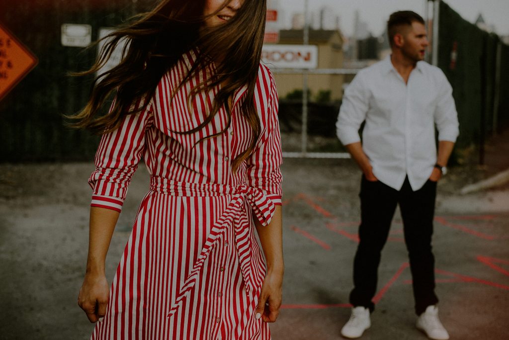 trendy couple poses for engagement photos