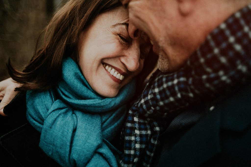 older couple posing for engagement photos