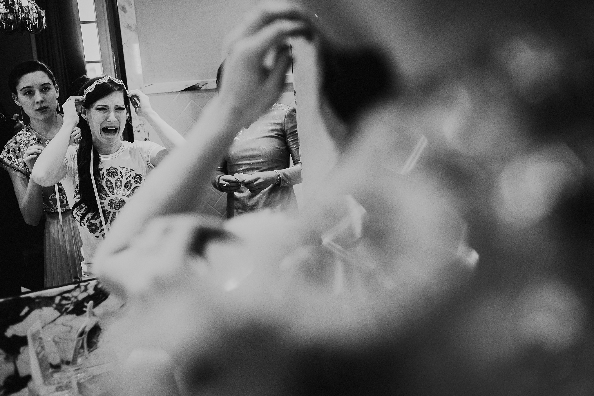 bride makes exaggerated expression at mirror