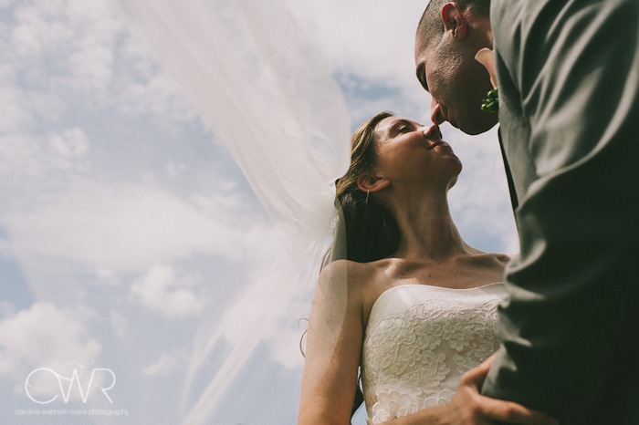Lake House Inn Perkasie PA Wedding: bride and groom kissing against clear sky
