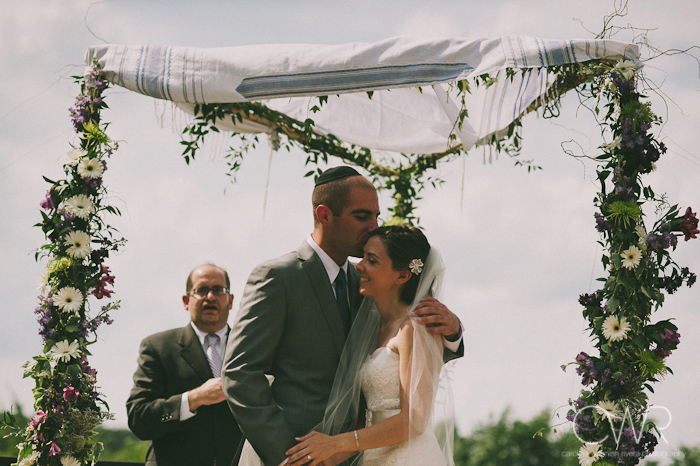 Jewish wedding ceremony at the Lake house Inn Perkasie PA: bride and groom kissing