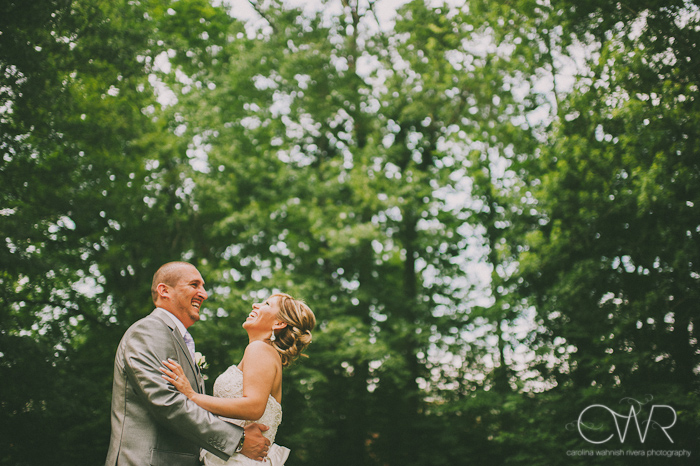 Olde Mill Inn Basking Ridge NJ Wedding: bride and groom laughing together by trees