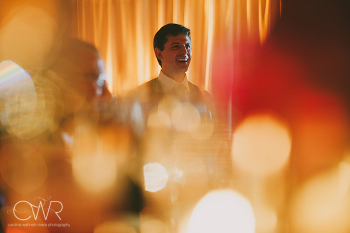 Harold Pratt House NYC Wedding: groom through glasses and candles