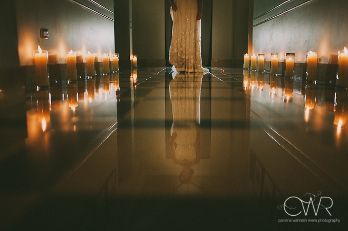 Harold Pratt House NYC Wedding: bride in corridor with candles, creative portrait