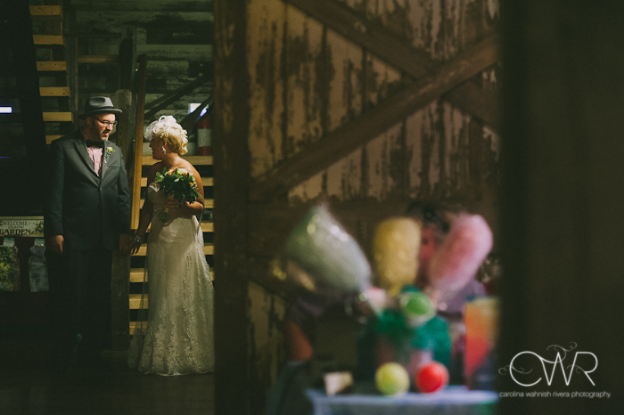 laurita winery wedding: bride and groom behind barn door waiting