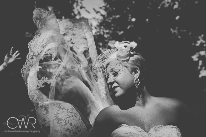 laurita winery wedding: creative portrait of bride in sun with dress flowing
