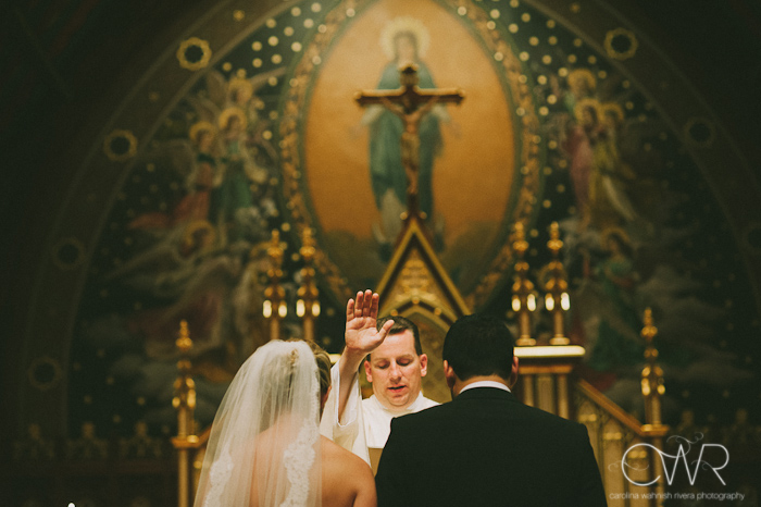 Seton Hall NJ Wedding: bride and groom blessed by priest