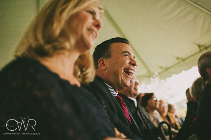 tented wedding in old chatham ny, guests laugh during vows