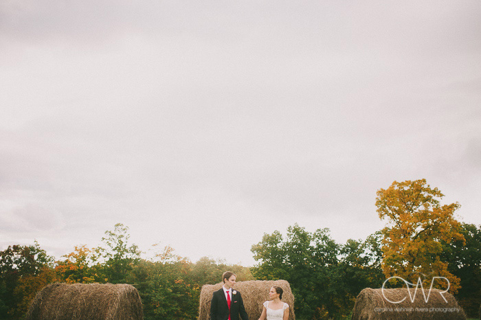 new york farm wedding portrait of bride and groom in haystack