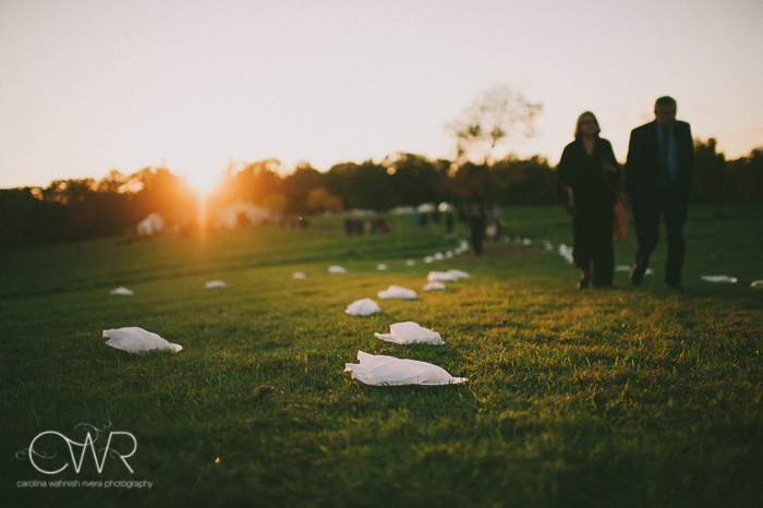 backyard wedding photography trail to reception tent as sun sets