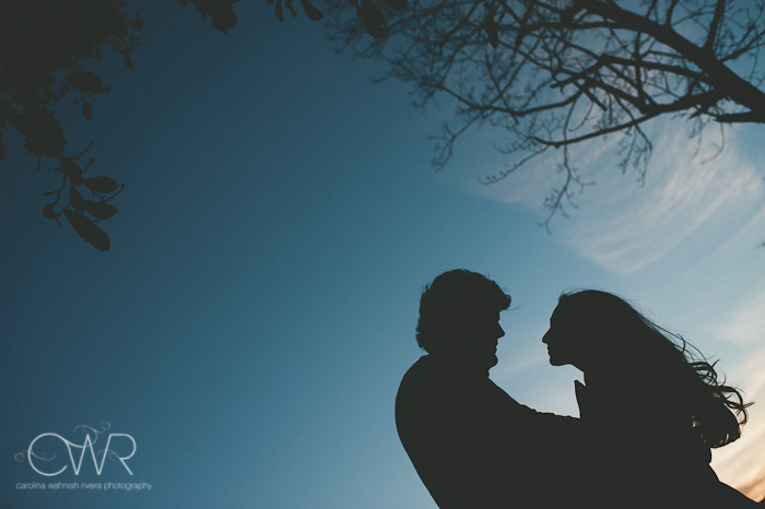 creative engagement photos silhouette of couple under bright blue sky for their Boston wedding