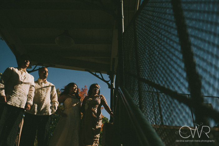 creative wedding photos of bridal party at glen ridge train station in nj