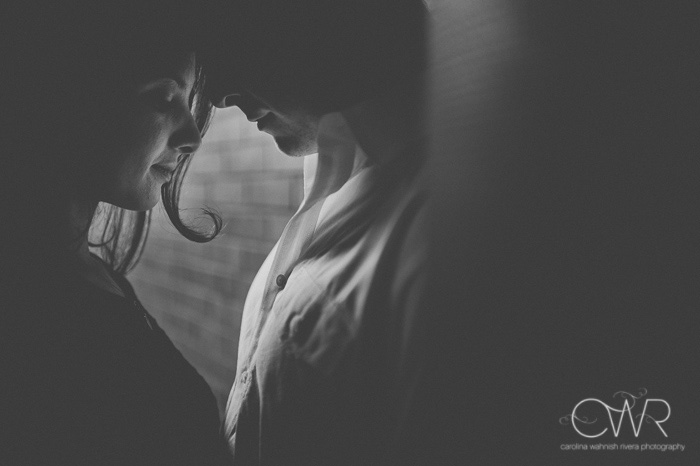 sexy engagement photos dramatic lighting in black and white