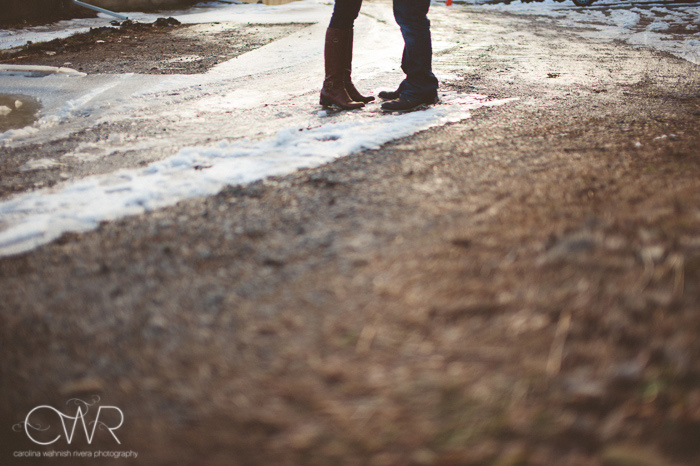 winter wedding photographer - creative engagement photo of couple's feet on snow and ice in road