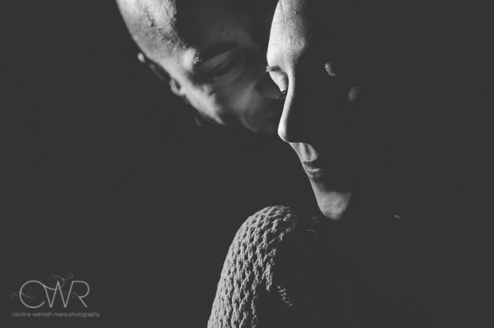 nyc fine art wedding photographer, fine art black and white engagement photo of groom whispering into bride's ear