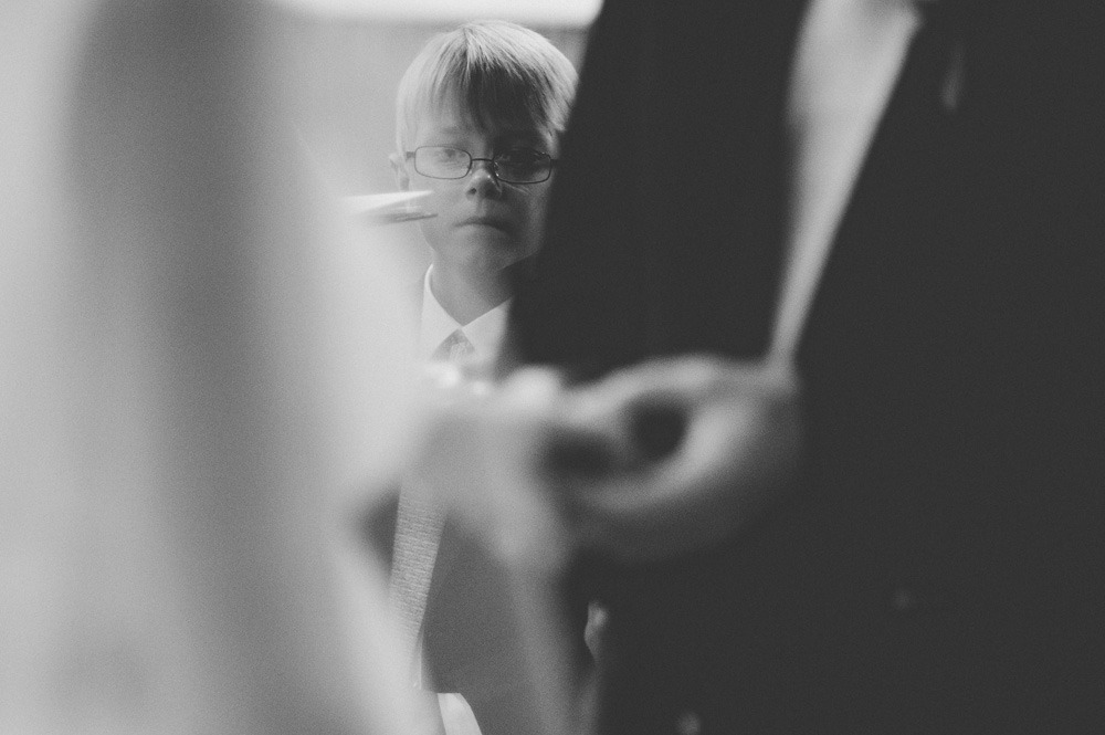 romantic weddings photo in black and white of little boy during ring exchange