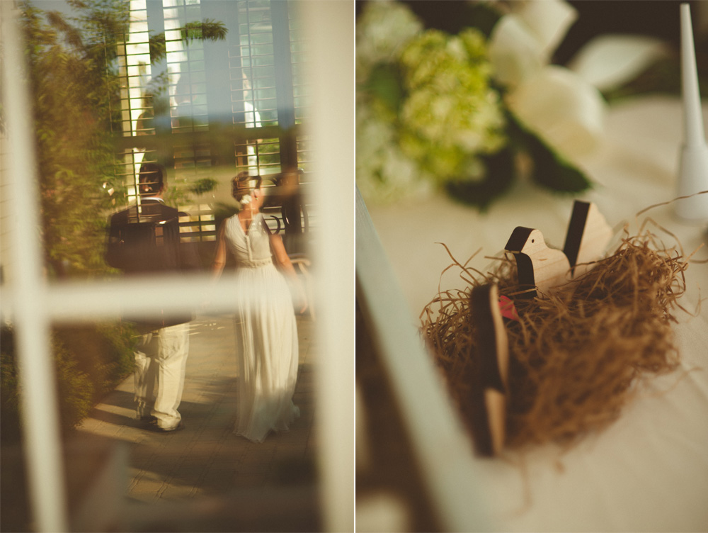 creative wedding photo of couple walking away in reflection and vintage wedding decorations