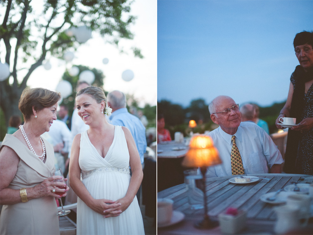 candid wedding photography moments between bride and guests at dusk
