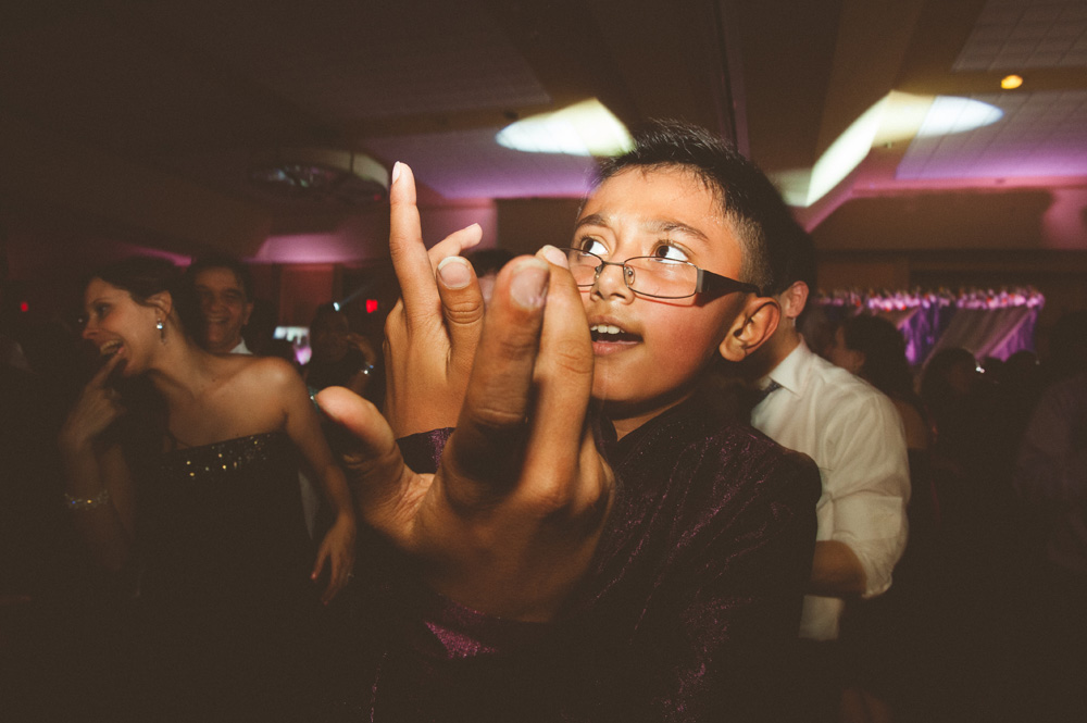 little boy dancing in creative wedding photography 