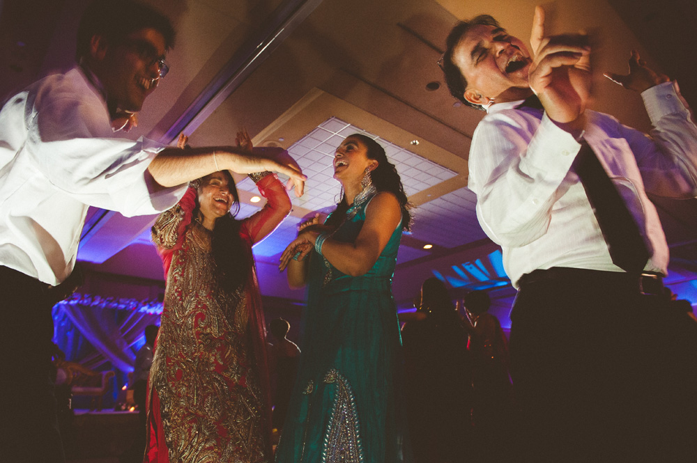 fine art wedding photography capturing creative dancing photos during cultural wedding in New Jersey