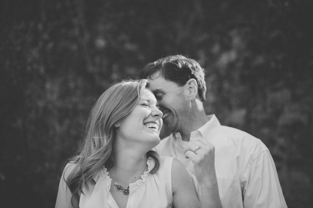 beautiful wedding photography in black and white carefree couple laughing at engagement session