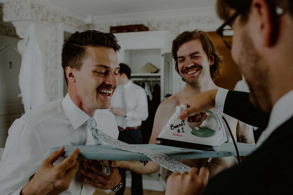 groom and groomsmen getting ready at bonnet island wedding suite