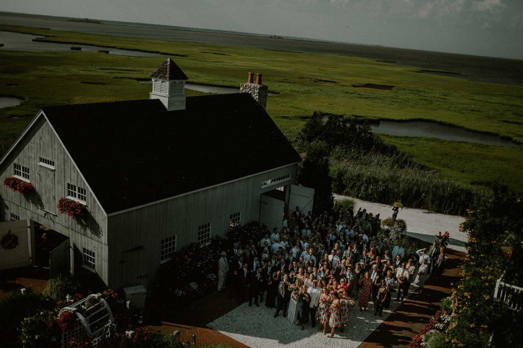 aerial shot of wedding guests next to bonnet island wedding chapel